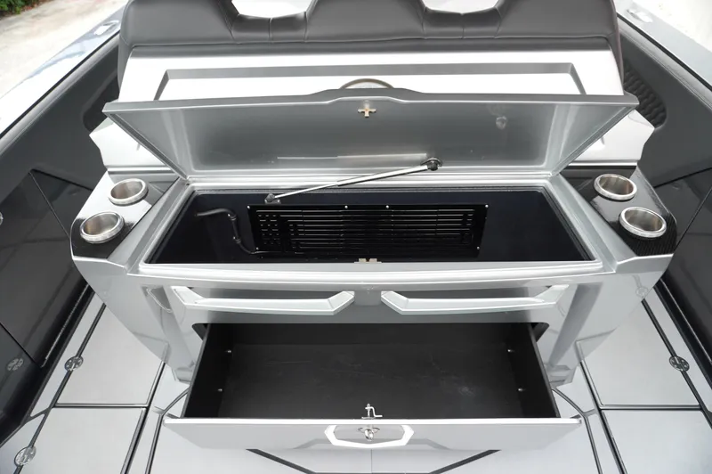 C Daze Yacht Photos Pics 2024 Adrenaline 47 Reaper boat interior with open storage compartments and cup holders.