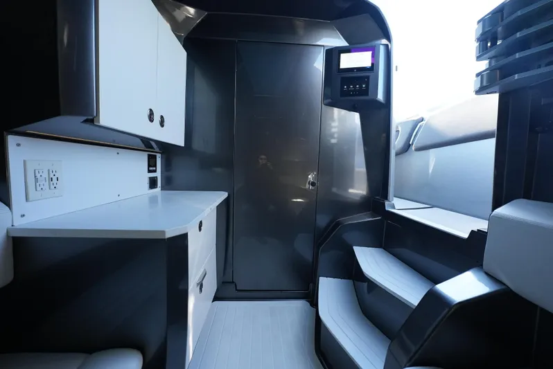 C Daze Yacht Photos Pics Interior of 2024 Adrenaline 47 Reaper boat, featuring sleek cabinetry and modern design.