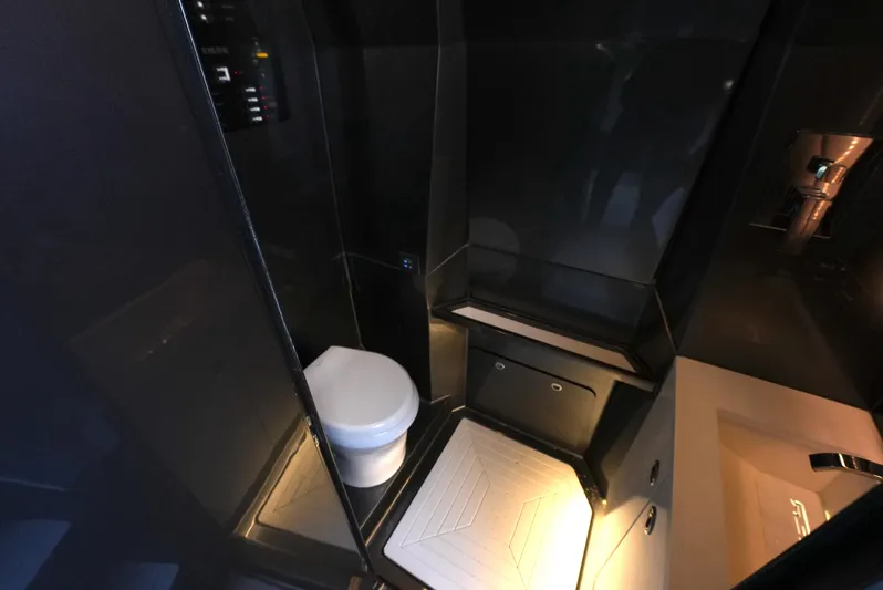 C Daze Yacht Photos Pics Luxurious bathroom interior of 2024 Adrenaline 47 Reaper yacht, featuring modern design and lighting.