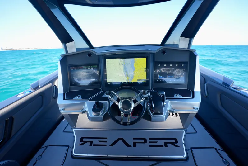 C Daze Yacht Photos Pics 2024 Adrenaline 47 Reaper boat dashboard with advanced navigation screens on open water.