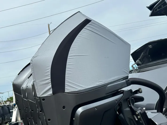 C Daze Yacht Photos Pics 2024 Adrenaline 47 Reaper engine cover, sleek design, outdoor setting.