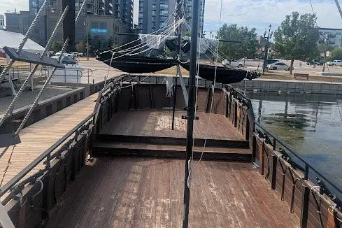  Yacht Photos Pics Wooden deck of a custom 2015 pirate ship docked at a marina.