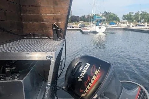  Yacht Photos Pics Custom 2015 pirate ship with Yamaha outboard motor in a marina setting.