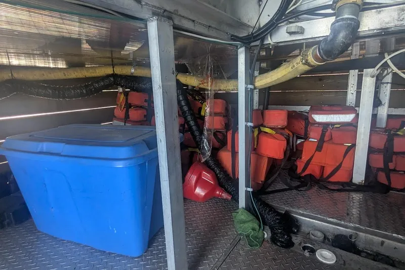  Yacht Photos Pics Interior of a 2015 custom pirate ship with life jackets and storage containers.