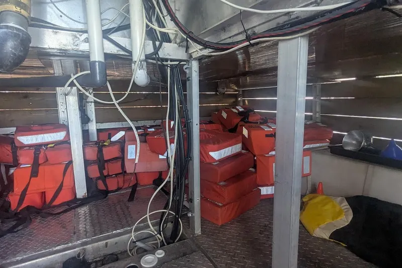  Yacht Photos Pics Interior of a 2015 custom pirate ship with stacked orange life jackets.