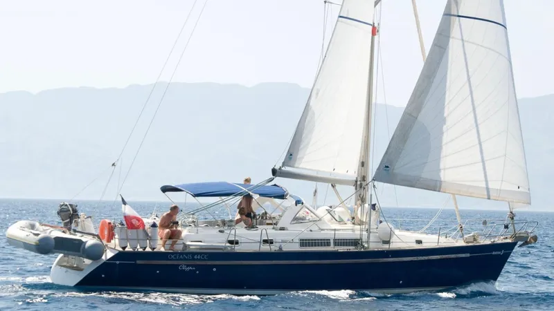 1730 Yacht Photos Pics Sailing yacht Beneteau Oceanis Clipper 44 CC, 1999 model, cruising on open water.