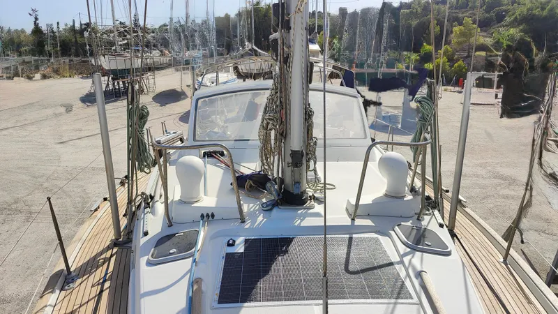 1730 Yacht Photos Pics Beneteau Oceanis Clipper 44 CC sailboat, 1999 model, docked with visible deck and mast.