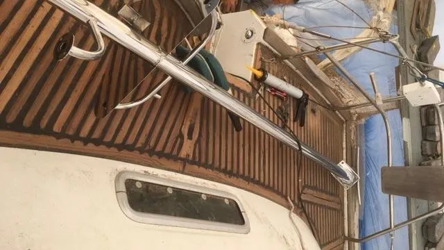 1730 Yacht Photos Pics 1999 Beneteau Oceanis Clipper 44 CC deck with wooden finish and sailing equipment.