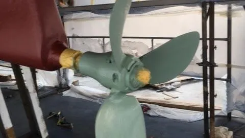 1730 Yacht Photos Pics Propeller of 1999 Beneteau Oceanis Clipper 44 CC sailboat in maintenance setting.