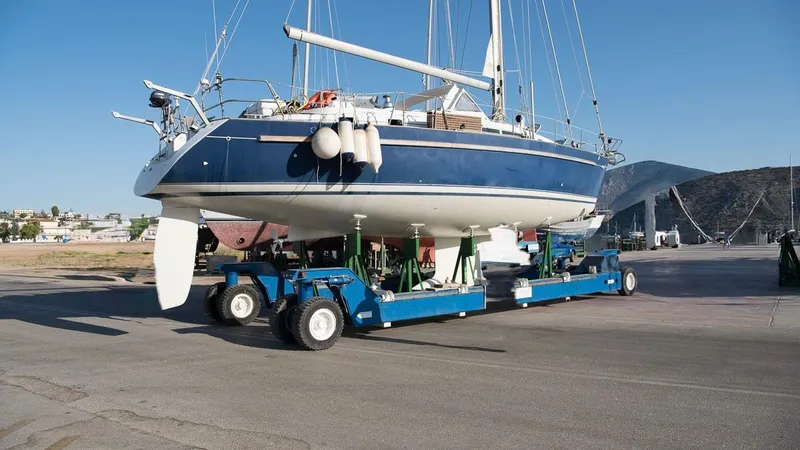 1730 Yacht Photos Pics 1999 Beneteau Oceanis Clipper 44 CC sailboat on transport trailer at marina.