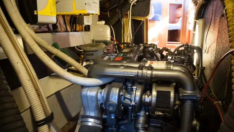 1730 Yacht Photos Pics Engine room of a 1999 Beneteau Oceanis Clipper 44 CC sailboat, showcasing mechanical components.