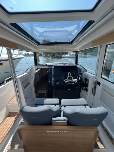 Crosswinds Yacht Photos Pics Interior of 2023 Nimbus C9 boat with modern helm and panoramic sunroof.