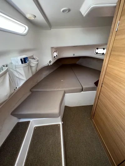 Crosswinds Yacht Photos Pics Modern interior cabin of 2023 Nimbus C9 boat with cozy sleeping area.