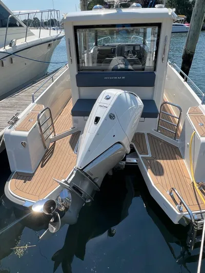 Crosswinds Yacht Photos Pics Nimbus C9 2023 model boat with outboard motor docked at marina.