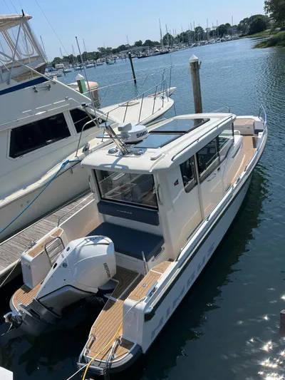Crosswinds Yacht Photos Pics 2023 Nimbus C9 boat docked at a marina.