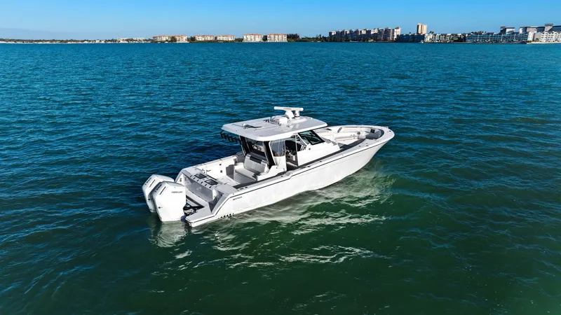  Yacht Photos Pics Bertram 39 CC 2023 on open water, modern design.