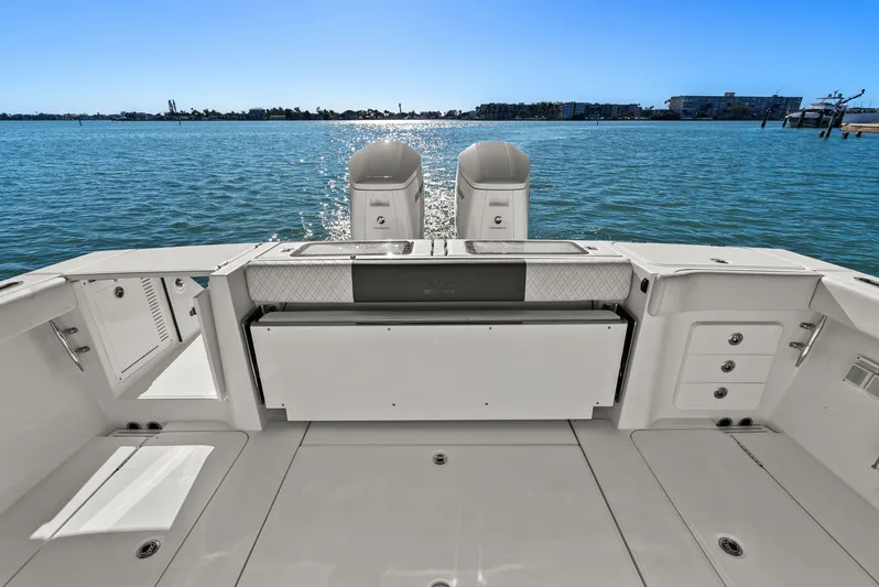  Yacht Photos Pics Bertram 39 CC 2023 boat rear with engines on open water.