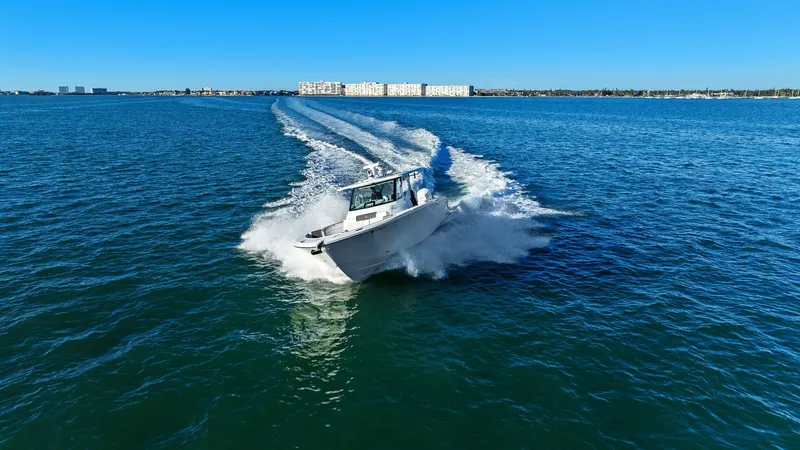  Yacht Photos Pics Bertram 39 CC 2023 cruising at high speed on open water.