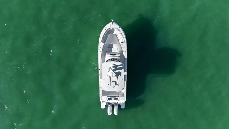  Yacht Photos Pics Aerial view of Bertram 39 CC yacht on green water, 2023 model.