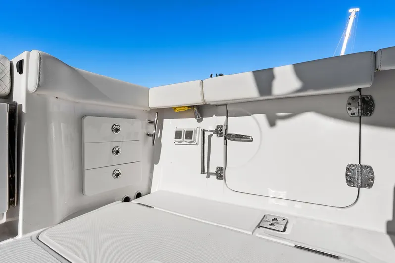  Yacht Photos Pics Interior of 2023 Bertram 39 CC with storage and blue sky.