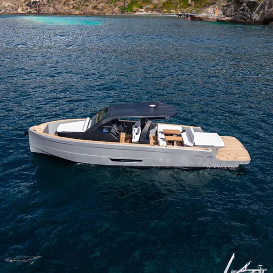 Max 43 Comfort Yacht Photos Pics 2026 Maxim Yachts 43 on serene blue water, showcasing sleek design and luxury features.