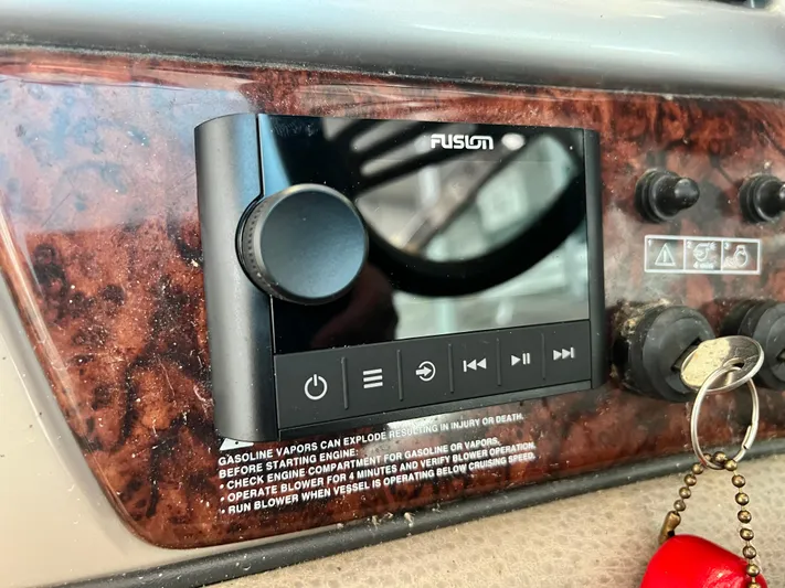 Ruby Yacht Photos Pics 2007 Four Winns 358 Vista dashboard with Fusion stereo system and ignition keys.