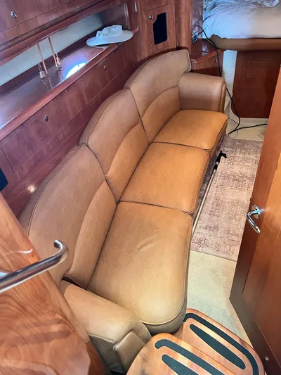 Ruby Yacht Photos Pics Luxurious interior of 2007 Four Winns 358 Vista yacht with tan leather seating.