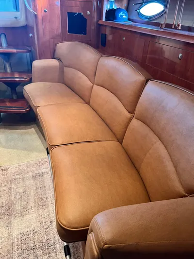 Ruby Yacht Photos Pics Luxurious tan leather sofa in 2007 Four Winns 358 Vista yacht interior.