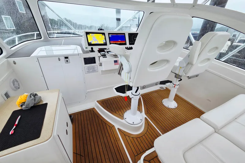 Salty Bear Yacht Photos Pics Interior of 2022 Albemarle 36 Express boat with modern helm and seating.