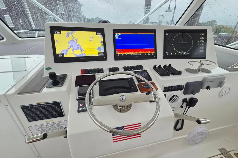 Salty Bear Yacht Photos Pics Helm of 2022 Albemarle 36 Express with advanced navigation displays and controls.
