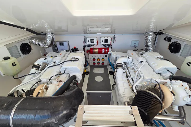 Salty Bear Yacht Photos Pics Engine room of 2022 Albemarle 36 Express boat, featuring dual engines and control systems.