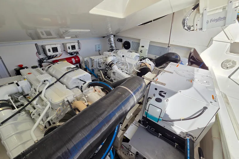 Salty Bear Yacht Photos Pics Engine room of 2022 Albemarle 36 Express, showcasing dual engines and equipment.