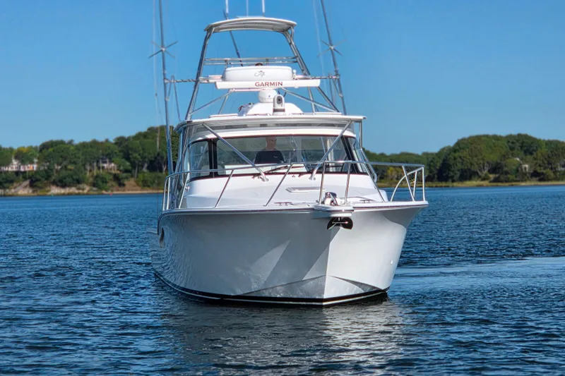 Salty Bear Yacht Photos Pics 2022 Albemarle 36 Express boat on calm water, clear sky background.