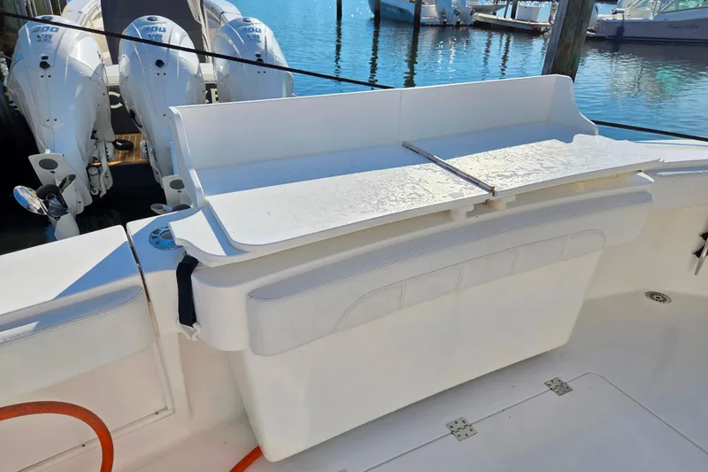 Salty Bear Yacht Photos Pics 2022 Albemarle 36 Express boat with outboard engines and seating area.