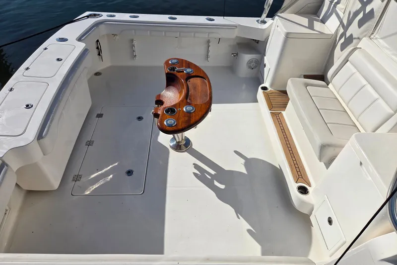 Salty Bear Yacht Photos Pics 2022 Albemarle 36 Express boat cockpit with seating and wooden table.