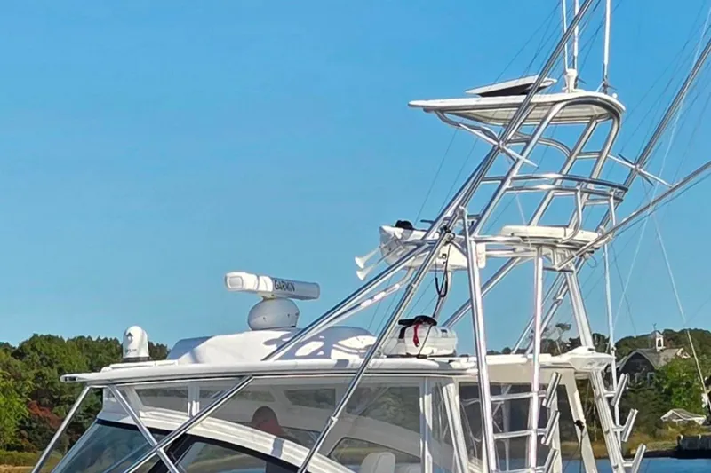 Salty Bear Yacht Photos Pics 2022 Albemarle 36 Express boat with tower against clear blue sky.