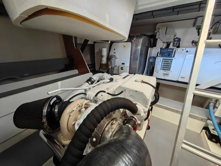  Yacht Photos Pics Engine room of 2021 Monte Carlo MC6 yacht, showcasing advanced machinery and equipment.