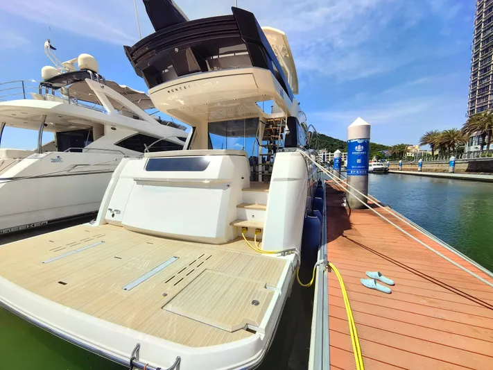  Yacht Photos Pics Luxury Monte Carlo MC6 yacht docked at marina, 2021 model, sunny day.