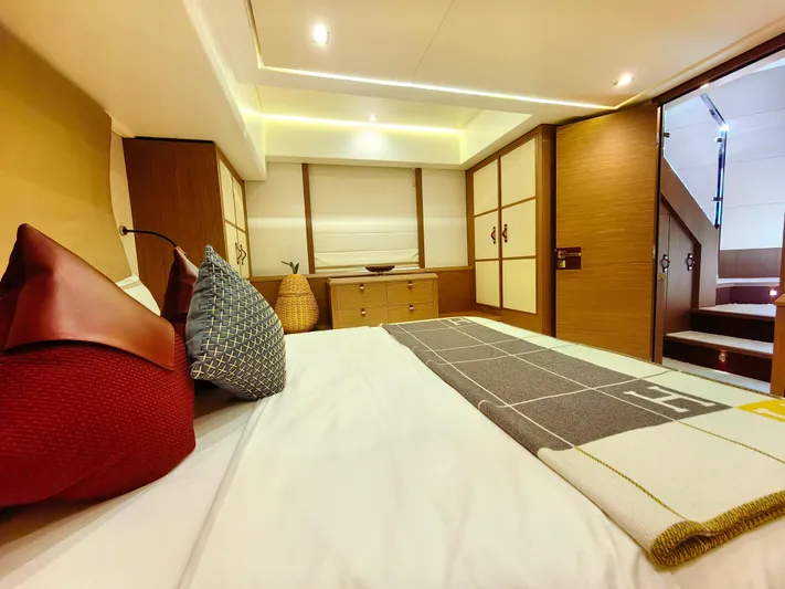  Yacht Photos Pics Luxurious bedroom interior of 2021 Monte Carlo MC6 yacht with modern design and cozy bedding.
