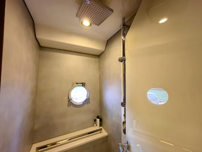 Yacht Photos Pics Modern bathroom with porthole window in 2021 Monte Carlo MC6 yacht.
