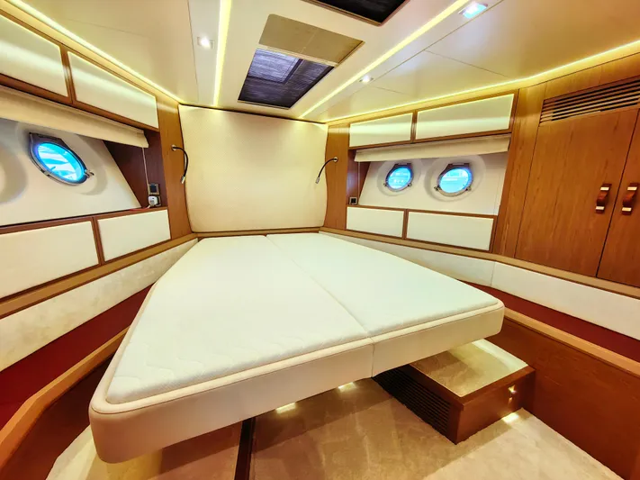  Yacht Photos Pics Luxurious 2021 Monte Carlo MC6 yacht cabin with elegant wood finishes and ambient lighting.