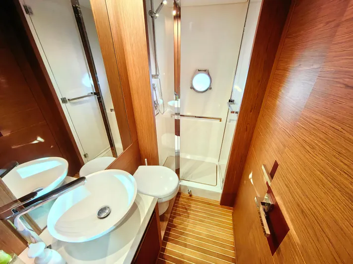  Yacht Photos Pics Luxurious Monte Carlo MC6 2021 yacht bathroom with modern fixtures and wooden accents.