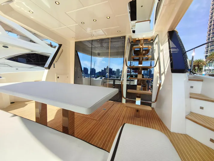  Yacht Photos Pics Luxurious 2021 Monte Carlo MC6 yacht interior with elegant seating and modern design.