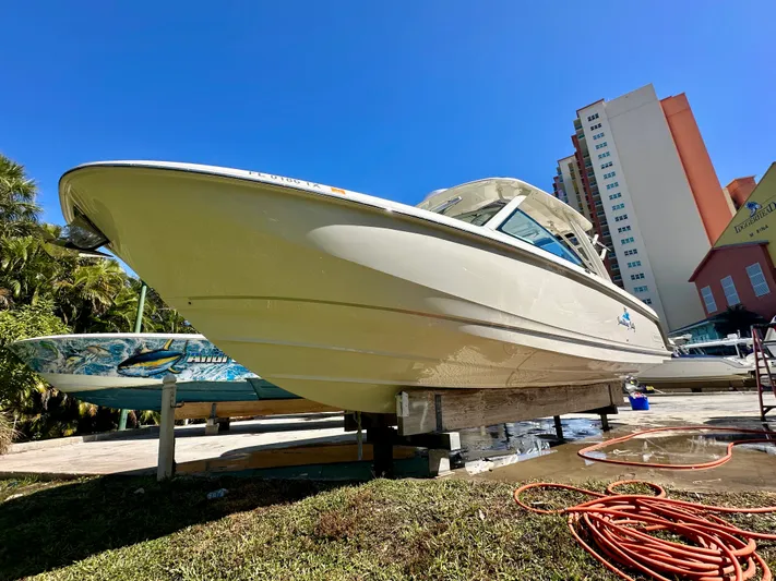 Yacht Photos Pics 2024 Boston Whaler 320 Vantage boat on a dock.