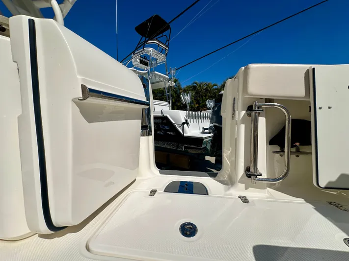  Yacht Photos Pics 2024 Boston Whaler 320 Vantage boat door and deck view.