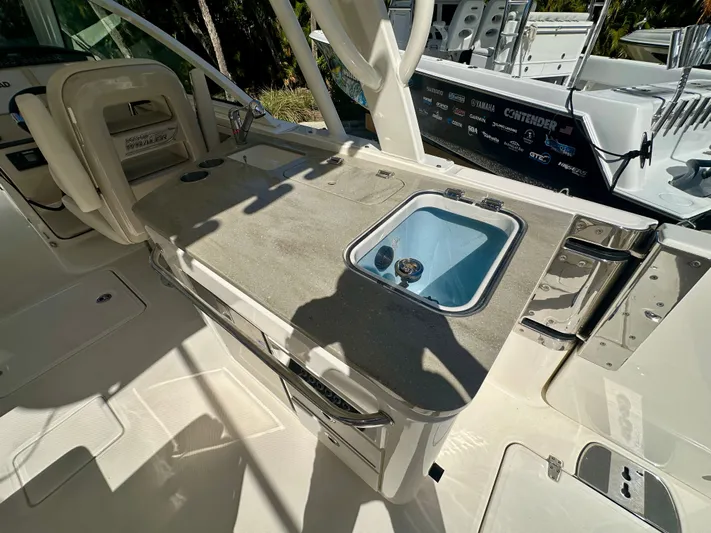  Yacht Photos Pics Interior of 2024 Boston Whaler 320 Vantage with sink and seating area.