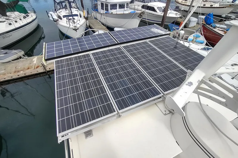 Bernardi Yacht Photos Pics Solar panels on a 2004 Nordic Tug 32 boat docked at a marina.