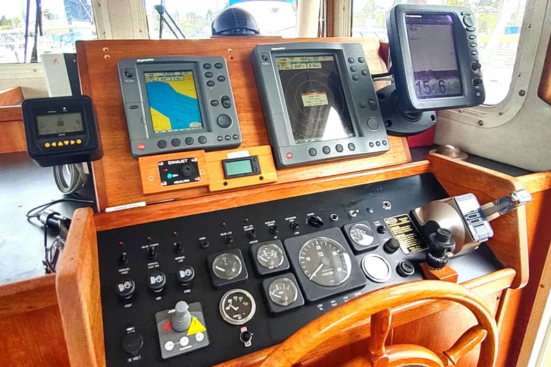 Bernardi Yacht Photos Pics Control panel of a 2004 Nordic Tug 32 with navigation instruments and gauges.