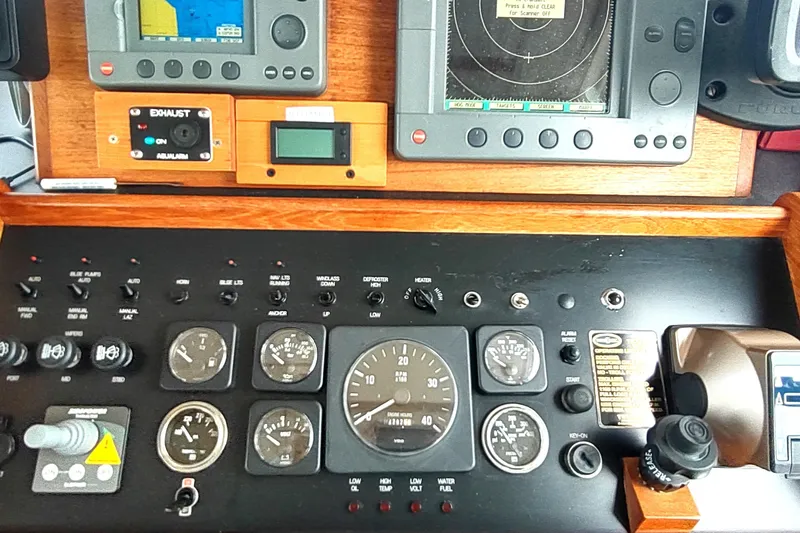 Bernardi Yacht Photos Pics Control panel of a 2004 Nordic Tug 32 with navigation and monitoring instruments.