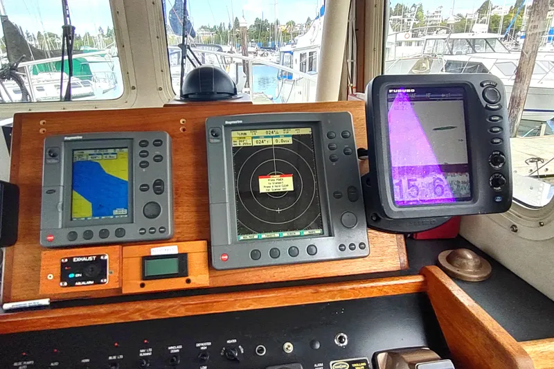 Bernardi Yacht Photos Pics Pilothouse of 2004 Nordic Tug 32 with navigation and radar displays.